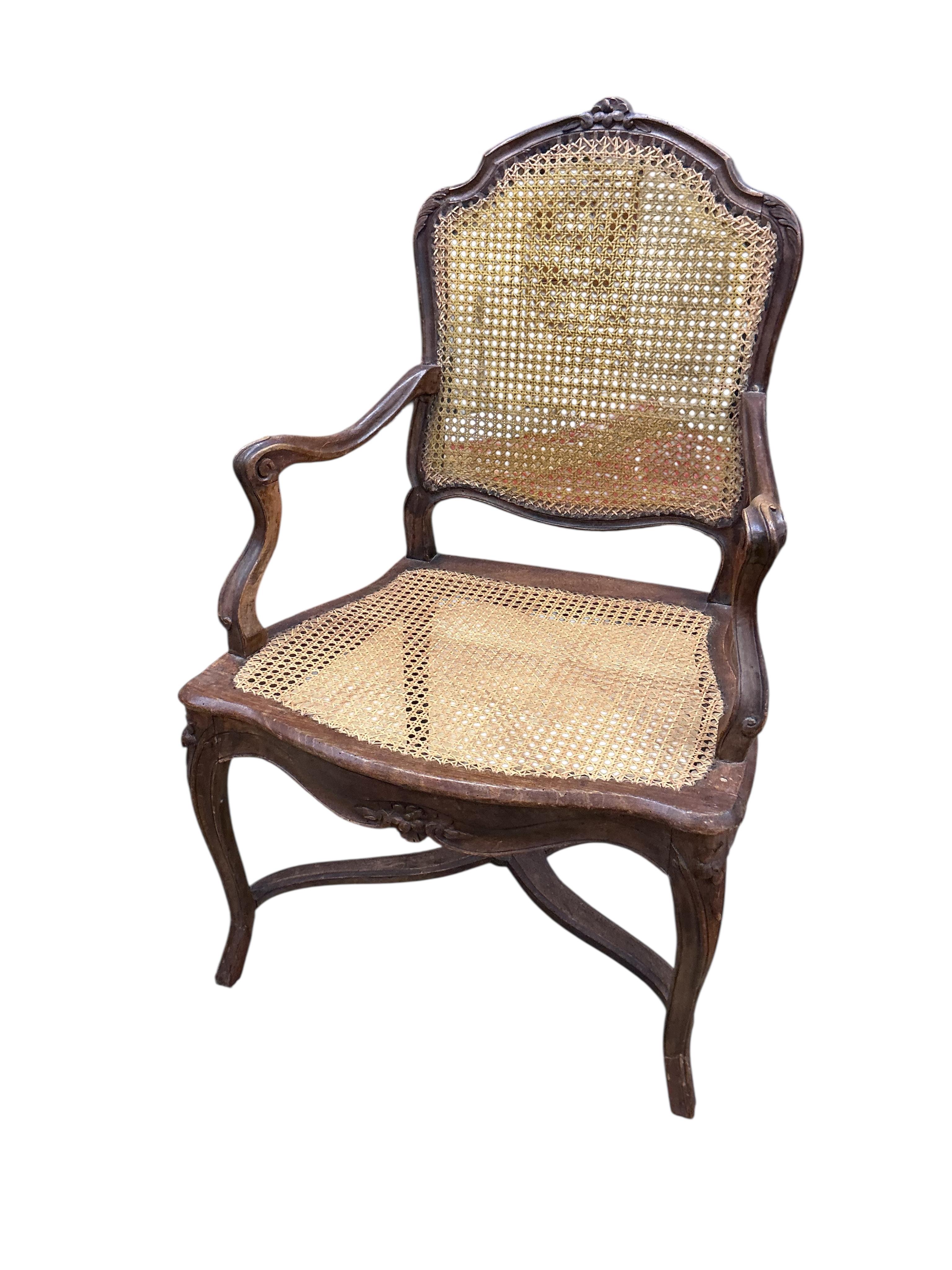 A 19th century French caned beech elbow chair, width 60cm, depth 48cm, height 90cm